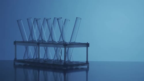 Close Up Video Neon Blue Light Test Tubes in a Laboratory Scientific Experiment Research Study