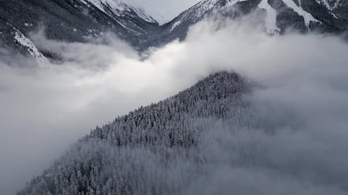 Mountains Covered in Snow and Fog