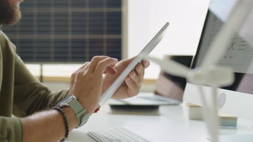 Man Using Tablet at Office Desk