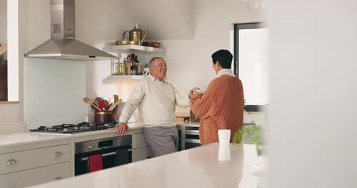 Adults Chatting in Bright Kitchen