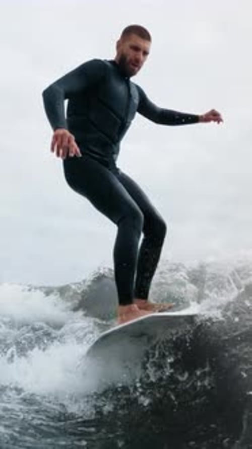 Dynamic Surfing Adventure A Skilled Surfer Riding Waves with Precision and Style Showcasing the