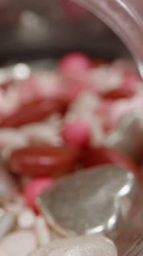 Heart Candy Spilling From Two Jars