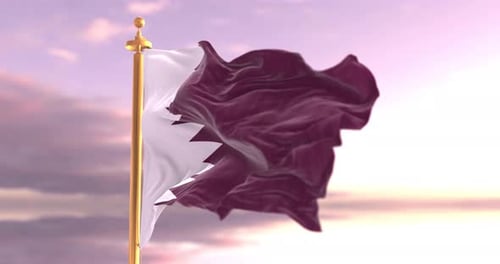 Qatar Flag Waving in the Wind at Sunset