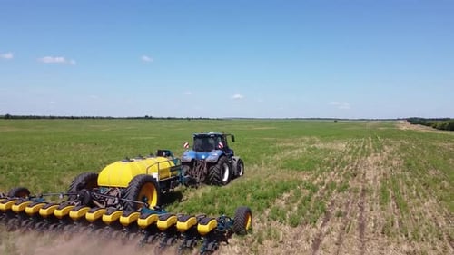 Blue Tractor O.A. Planting Canola On No Till Field