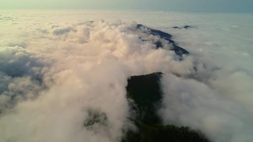 Dense Clouds Creeping Over Slanted Plateau
