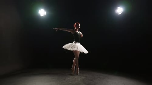 Dramatic Ballerina Dancing in Studio Professional Ballet Dancer Young Woman in Pointe Shoes and