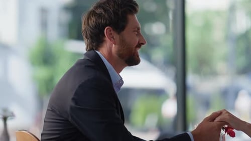 Happy Spouses Holding Hands Enjoying Romantic Date in Cozy Cafeteria Closeup