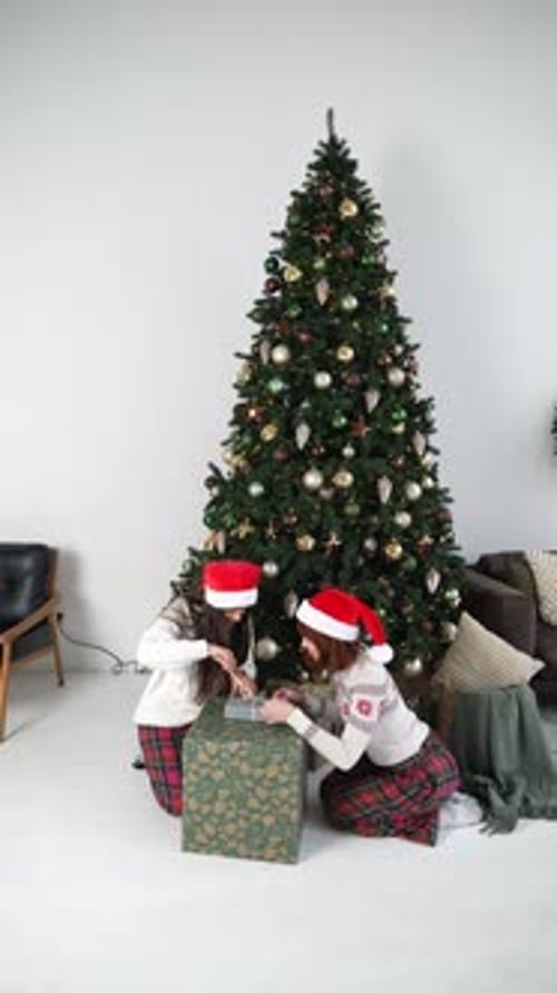 Women Open a Gift Box on New Year's Eve