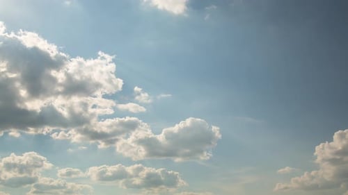 The Sky and Beautiful Clouds and the Sun on a Warm Summer Day
