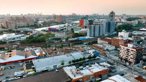 Construction site near the railways and busy roads. New York cityscape from top perspective.