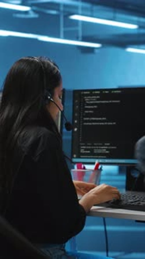 Woman Working at Computer in Modern Office