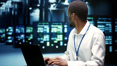 IT Developer Checking Electronics for Data Center Maintenance