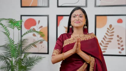 Woman in Saree Claps Hands and Smiles