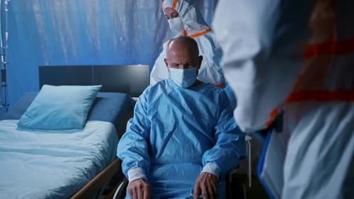 Doctor And Covid-19 Infected Patient In Wheelchair In Hospital, Coronavirus Concept.