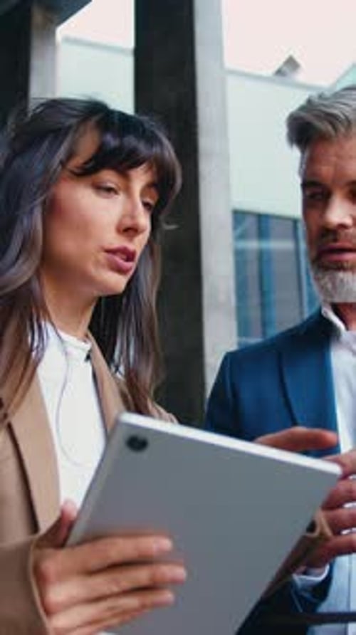 Close Up of Two Business People a Man and a Woman in Formal Attire are Standing Outside a Modern