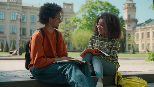 Two African American Friends Students Girl Female Woman with Guy Man Male in City Outdoors in