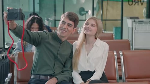 Happy Couple Poses for Camera at Airport