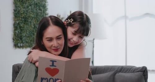 Affectionate Daughter Gives Mother a Handmade Card