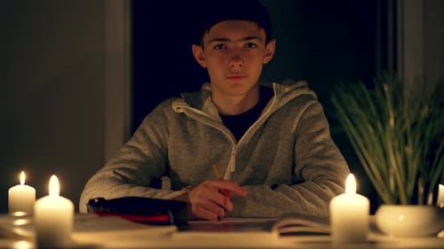 Boy at Table with Candles