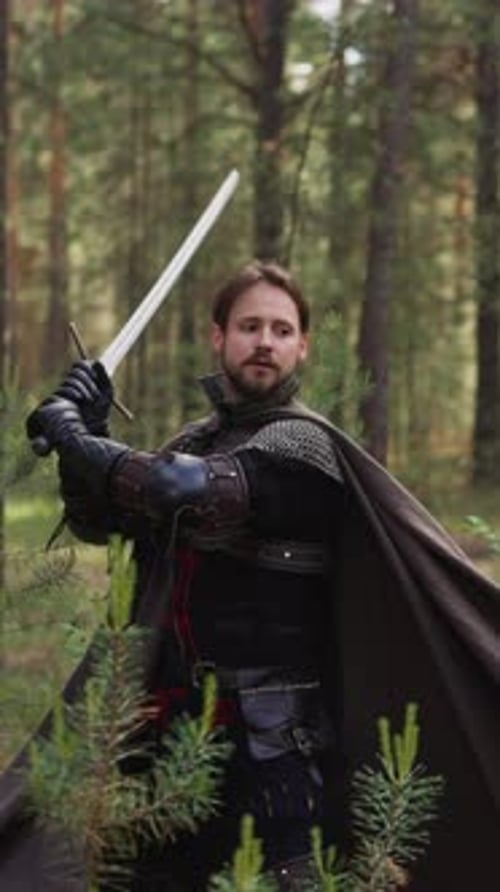 Nobleman in Armor with Cape Teaches Peasants Sword Fighting