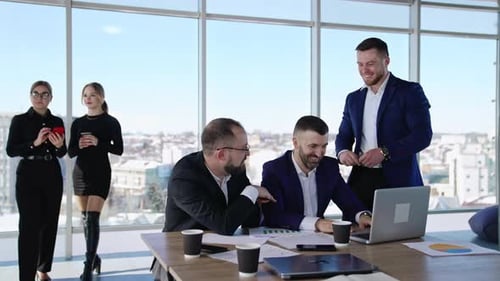 Business Team Discussing Strategy in Bright Office