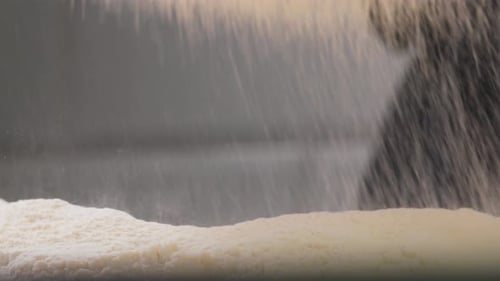 Flour Being Poured onto Counter in Macro Shot