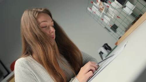 Close-up: woman lawyer office worker proofreading a contract before signing