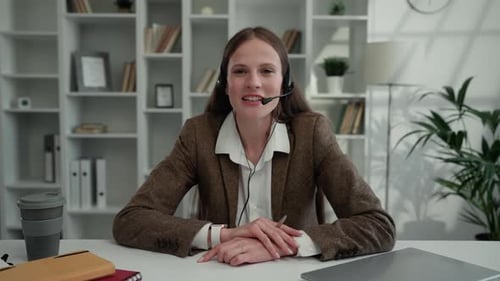 POV Charming Positive Caucasian Lady Office Worker with Headphones and Microphone Speaking with