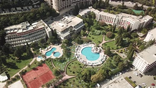 Bečići town in the municipality of Budva, Montenegro aerial top down of swimming pool resort