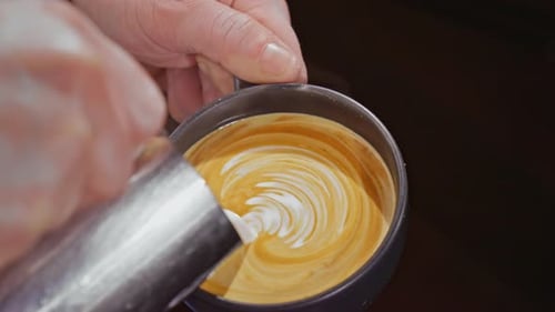 White Liquid Pouring Into Coffee For Art