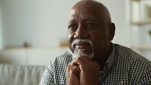 Senior African American Man Enjoying Quiet Moments at Home in His 60s