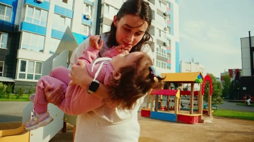 Joyful Moments A Playful Mother and Daughter Experience Wonder and Laughter at the Playground in a