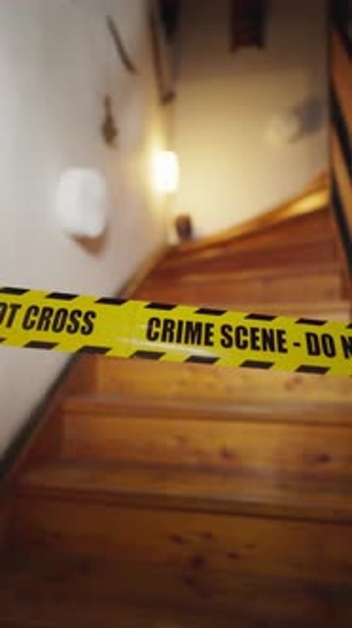 Crime Scene Tape on Wooden Staircase at Night