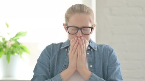 Woman Blowing Her Nose with a Tissue