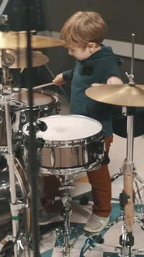 Little Boy 5 Years Playing Drums in Music Studio
