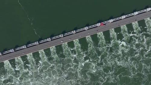 Aerial view of storm surge barrier and bridge over water, Netherlands.