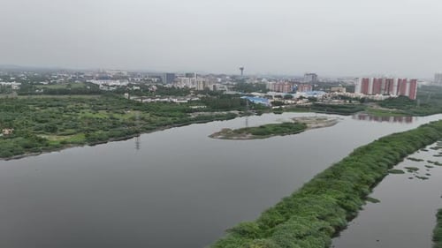 Aerial drone footage of the Chennai East Coast Road area featuring Buckingham Canal