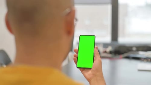 Hispanic Man Using Phone with Green Screen
