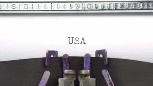 USA word closeup being typing and centered on a sheet of paper on old vintage typewriter