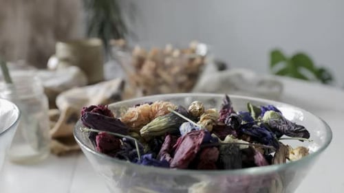 Dried colorful flowers displayed in glass bowl