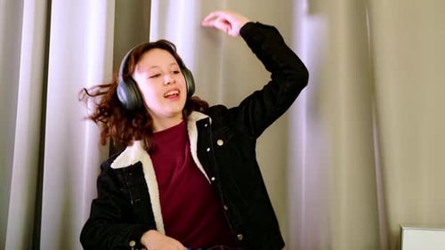 Teen Girl Mixing Music with Audio Mixer in Studio