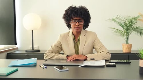 Young Woman Smiling in Modern Office Environment