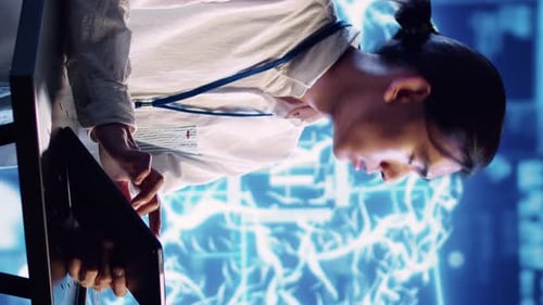 Young Adult Working on a Tablet in Futuristic Office