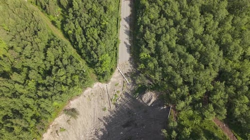 A Forested Slope and a Landslide Cutting Across a Narrow Road at Old E69, Talvik Kråknesveien,
