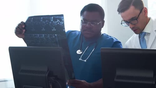 Doctor and Surgeon Talking Near Window Medical Workers in Hospital Office Day Light Healthcare