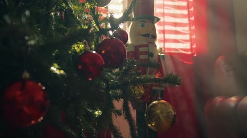 Nutcracker Behind the Christmas Tree in the Living Room