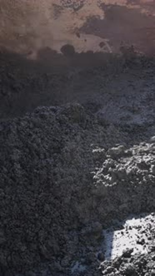 Shovel Mixing Fresh Concrete