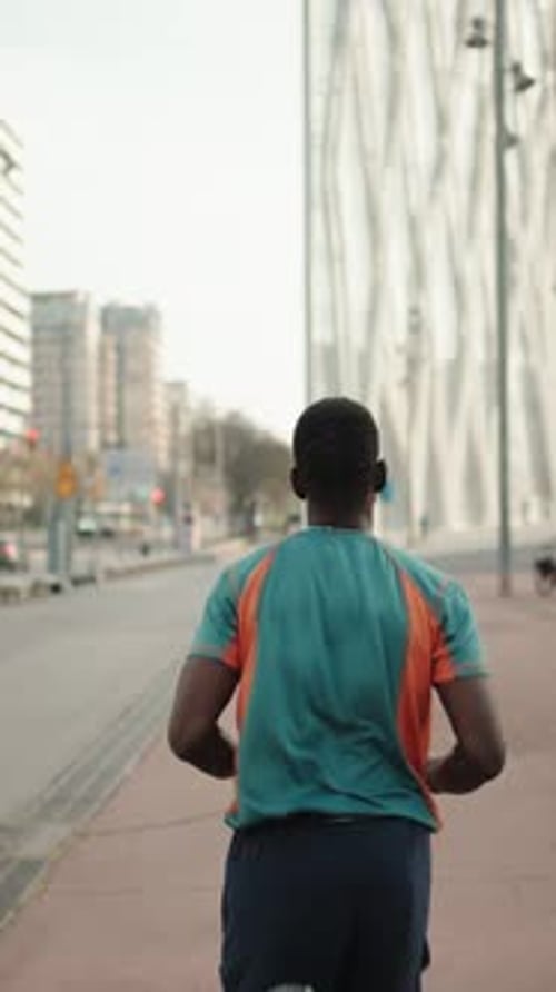 African American Man Running in the City Training Sports in the Morning
