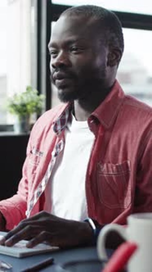 Man Works at Computer in Modern Office
