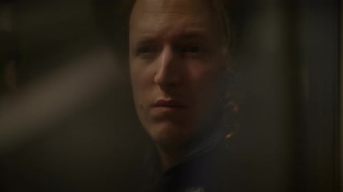 a Close Up of a Woman s Face in a Dark Room